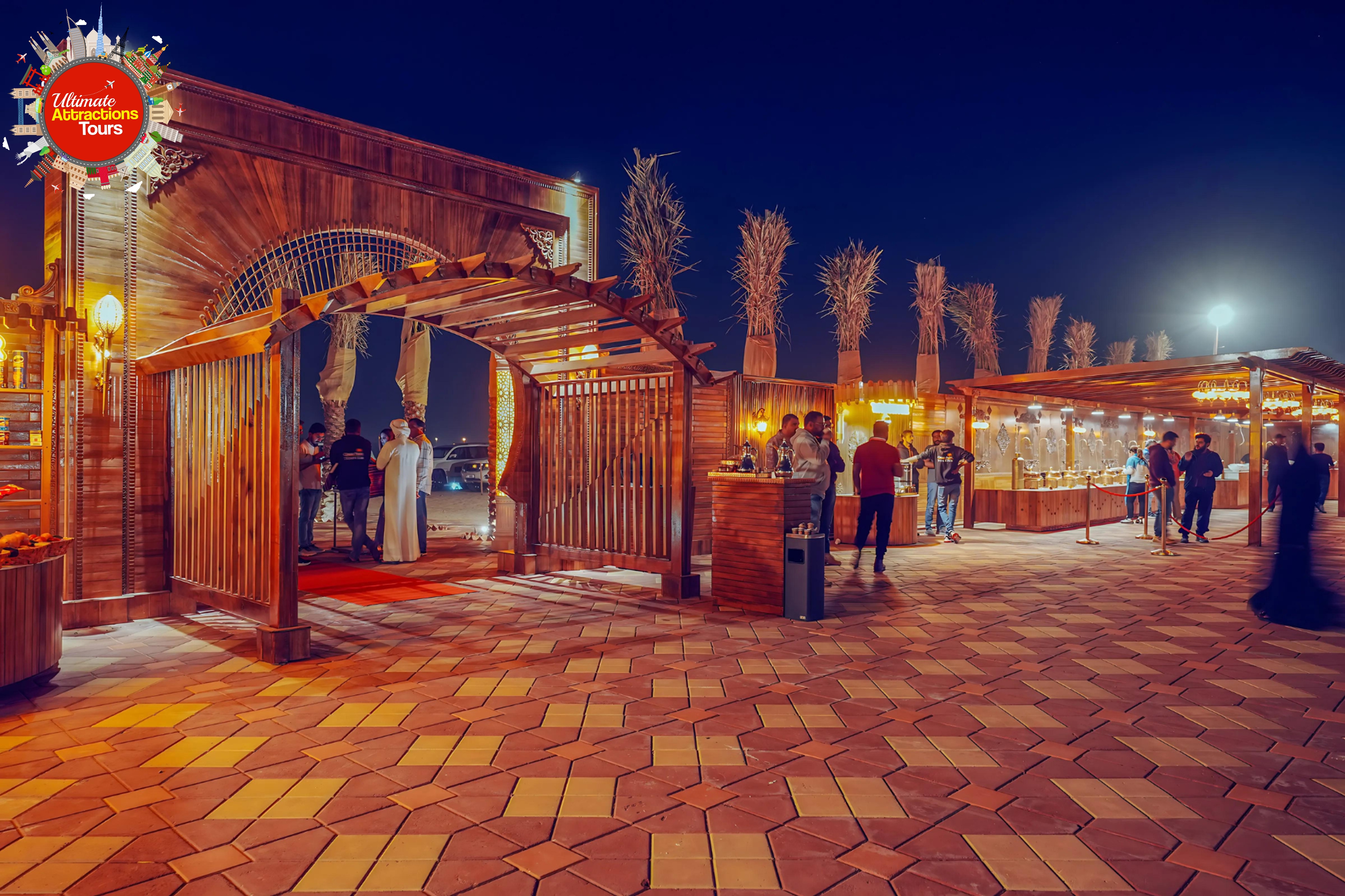 Premium desert camp at sunset with illuminated tents
