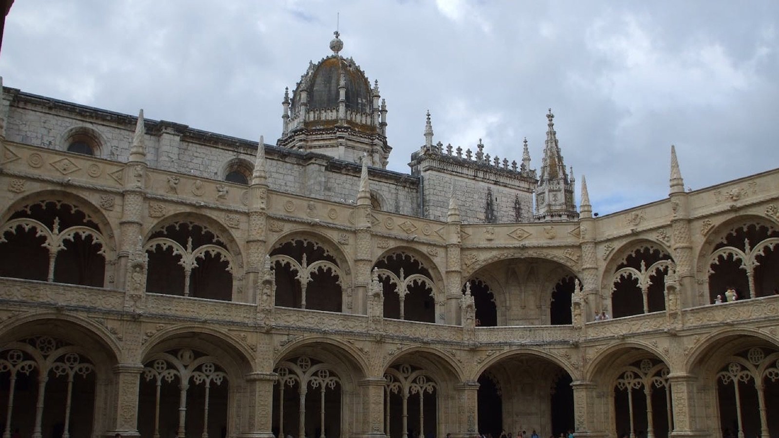 Two-storey cloister with intricate carvings